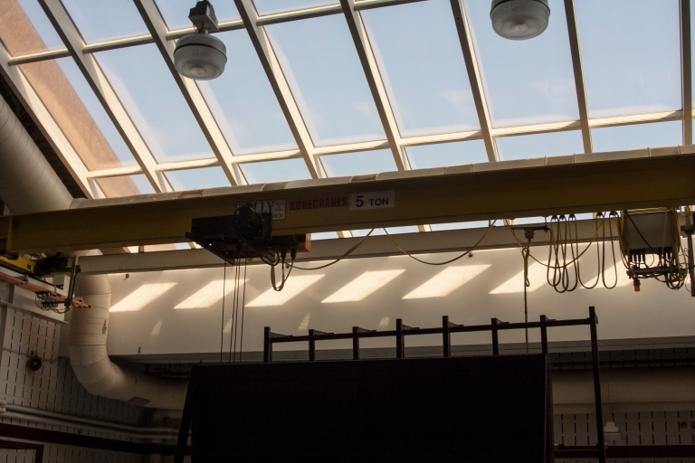 A 5-ton crane in one of the lower level rooms near the loading bay.