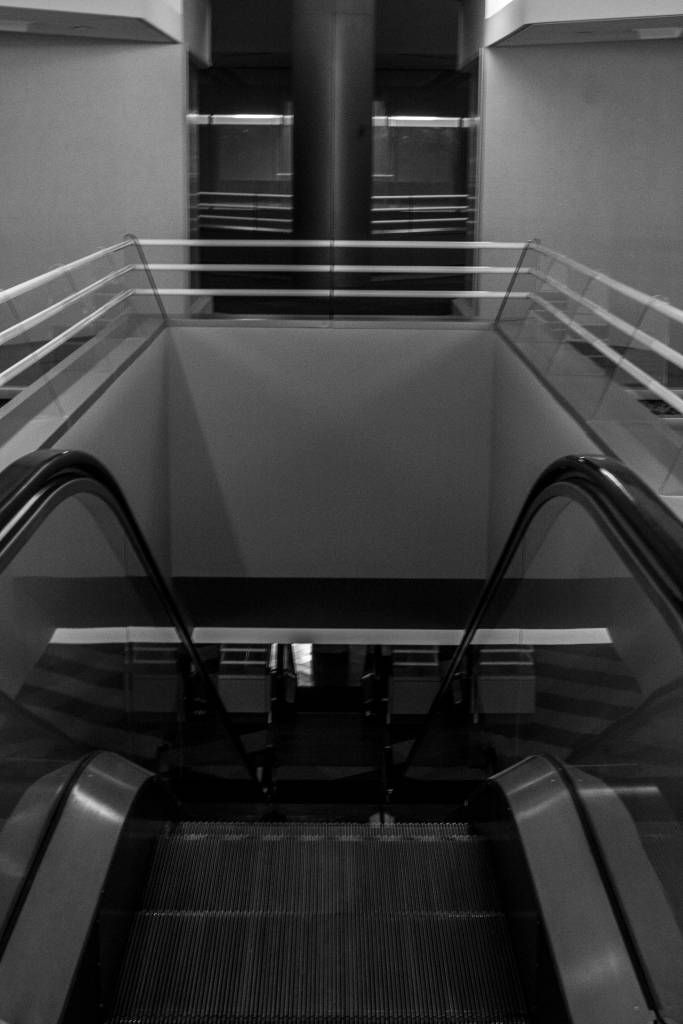 Looking down two sets of escalators, neither of which worked.